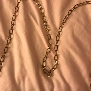 Black purse with gold chain strap